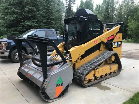 compact track loader clearing land|articulated land clearing truck.